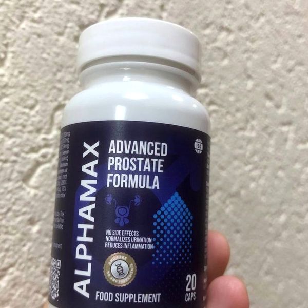 Flacone bianco e blu di AlphaMax da 20 capsule tenuto in mano
